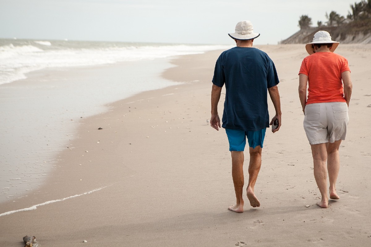 Retire couple walking in Bali beach